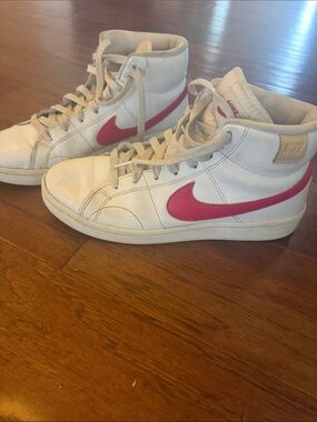 Nike White High-Top Sneakers with Pink Swoosh
